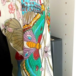 Anthropologie pullover shirt with beautiful sheer sleeve butterfly detail